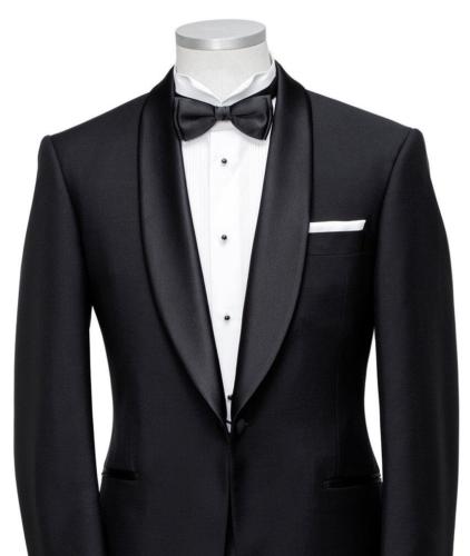 Zwarte smoking met wit smoking overhemd met pique en zwarte studs